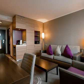 Furniture and lounge area with a sofa in a Holiday Inn Kyiv room