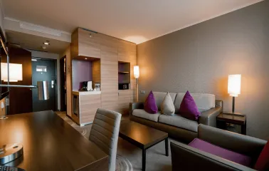 Furniture and lounge area with a sofa in a Holiday Inn Kyiv room