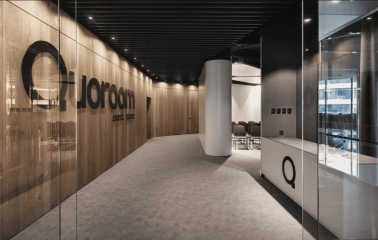 IQ Business Center in Kyiv - hallway featuring wooden wall with Quoroom event space logo