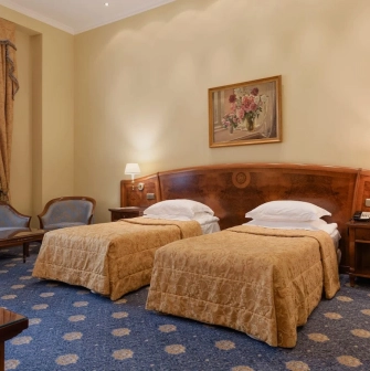 Classic room at Premier Palace Hotel in Kyiv with two beds and a seating area