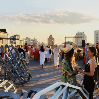 Kooperativ - multi-level outdoor terrace with greenery and seating areas