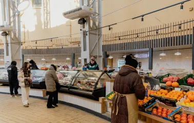 Visitors browsing fresh produce stalls at Bessarabskyi Market in Kyiv