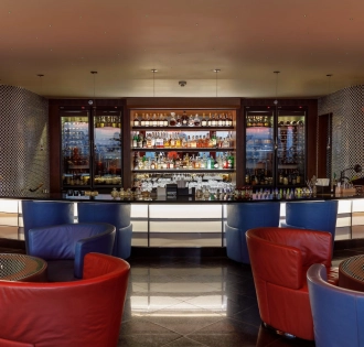 B-hush - a modern bar with numerous drinks and warm lighting