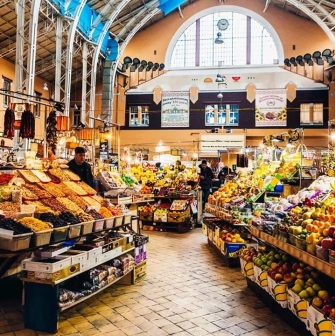 Colorful counters with fruits and vegetables in the historic interior of the Bessarabian market