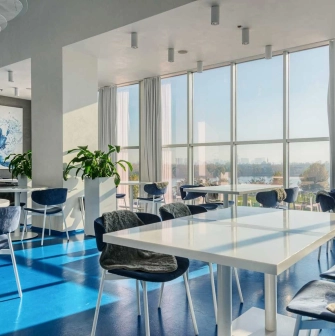 Egersund - casual interior with light wooden chairs and simple modern decor