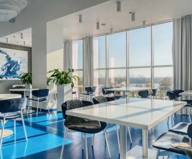 Egersund - casual interior with light wooden chairs and simple modern decor