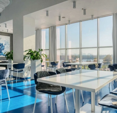 Egersund - casual interior with light wooden chairs and simple modern decor