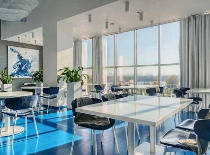 Egersund - casual interior with light wooden chairs and simple modern decor