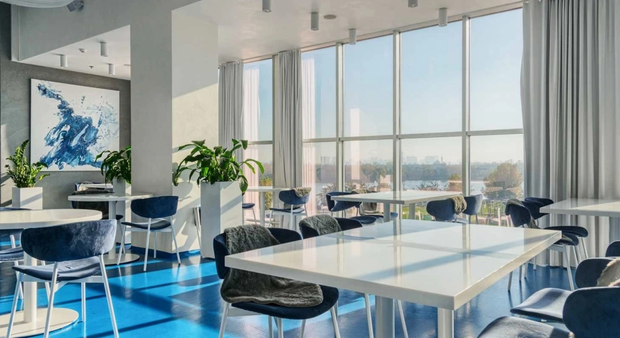 Egersund - casual interior with light wooden chairs and simple modern decor