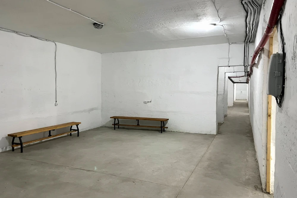 A long hallway in a bomb shelter in Kyiv