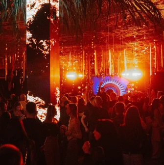 Kureni - indoor dance floor with crowd and orange stage lights