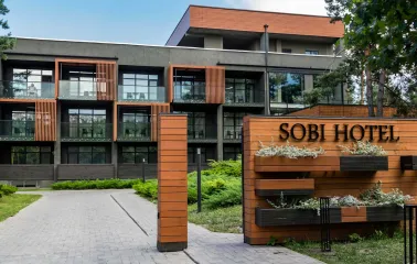 Facade of the modern Sobi Club hotel building in the forest