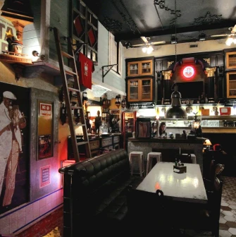 Vintage seating room at Buena Vista Social Club with brick walls