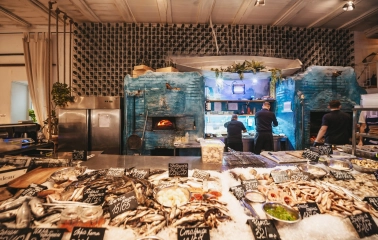 Seafood counter at Chornomorka restaurant in Kyiv with a large selection of fresh seafood