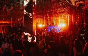 Kureni - indoor dance floor with crowd and orange stage lights