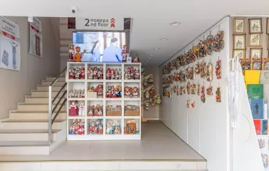 Interior view with souvenir dolls and stairs to the second floor of the Folkmart store in Kyiv