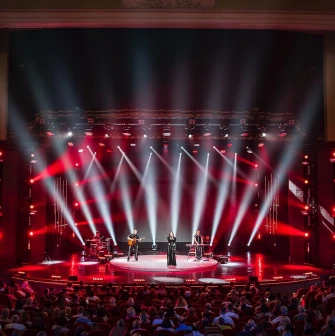 October Palace in Kyiv - concert stage illuminated by red spotlights beams