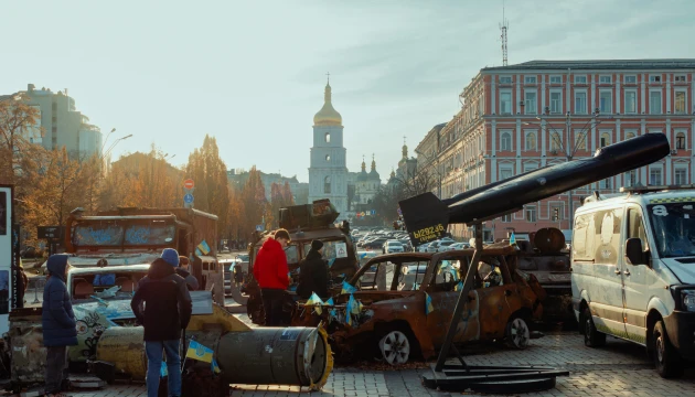 St. Michael's Cathedral in Kyiv - destroyed cars and missile part on square