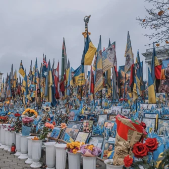 Independence Square in Kyiv - rows of portraits of fallen soldiers, flowers, and flags