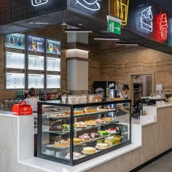 Restaurant Puzata Hata - dessert bar with a glass display case full of cakes and pastries