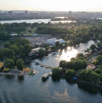 X-Park in Kyiv - aerial panoramic view of the green islands, river channels and sports zones