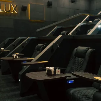 Premium black leather LUX category armchairs in the Multiplex cinema