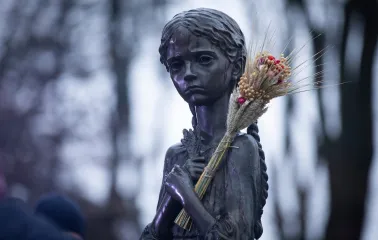 Sculpture of a girl with wheat spikes (Bitter Memory of Childhood) near the Holodomor Memorial