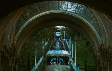Kyiv Funicular - view through the station arch of a blue carriage ascending