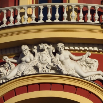 Syrotkin House - elegant white figures of women adorning the hotel facade