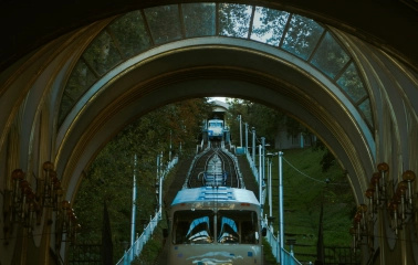 Kyiv Funicular - view through the station arch of a blue carriage ascending