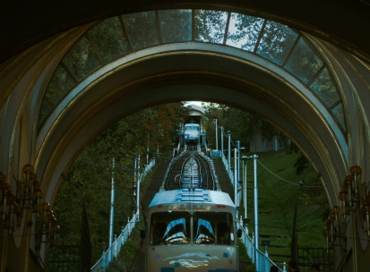 Kyiv Funicular - view through the station arch of a blue carriage ascending
