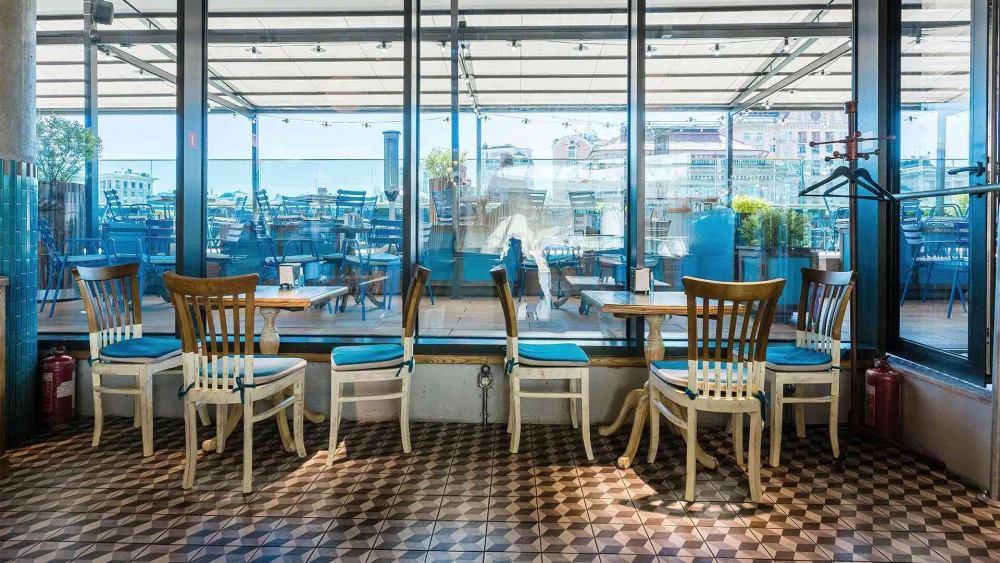 View of the Milk Bar terrace in TSUM through panoramic windows