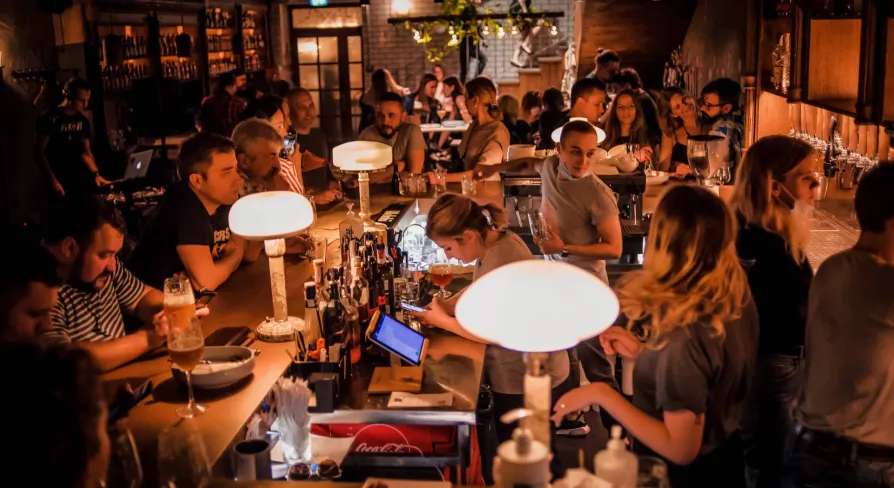 Pab Kedy - busy bar counter with bartenders serving drinks to many guests