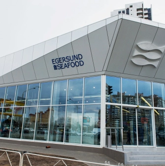 Egersund - storefront facade with signage and large glass windows