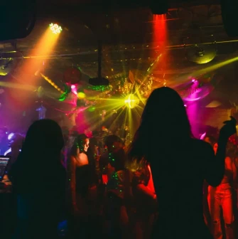 Vechirochka - nightclub crowd under pink and yellow stage lights