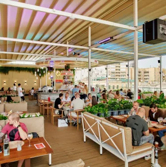 Q Terrace - a spacious open terrace with sofas and lots of greenery