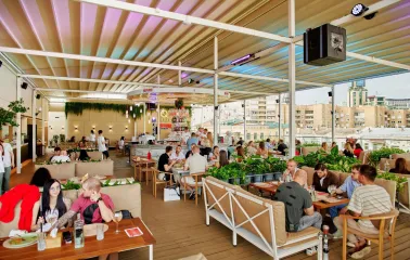 Q Terrace - a spacious open terrace with sofas and lots of greenery