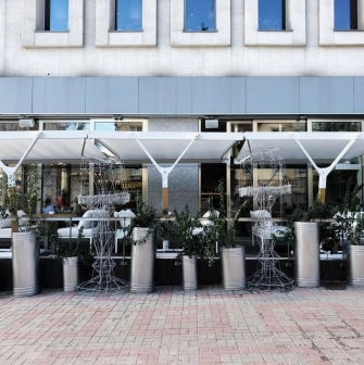 Holy Burger - facade with signage and large windows overlooking the street