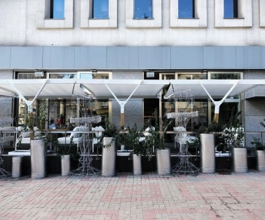 Holy Burger - facade with signage and large windows overlooking the street