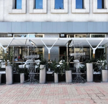 Holy Burger - facade with signage and large windows overlooking the street