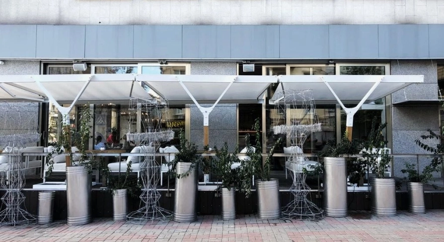 Holy Burger - facade with signage and large windows overlooking the street