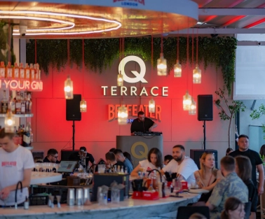Q Terrace - an indoor dining area with elegant modern furniture and a bar