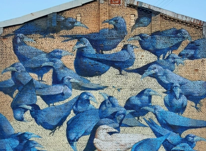 Messenger of Life in Kyiv - mural depicting a white crow symbolizing bright life amidst darkness