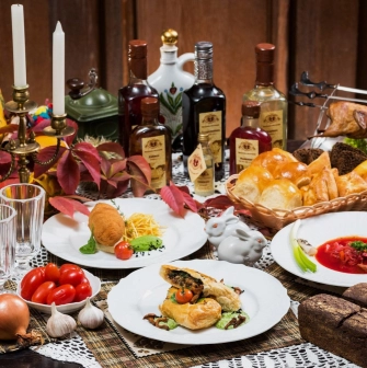Restaurant Za Dvoma Zaicyamy - banquet table with traditional Ukrainian dishes