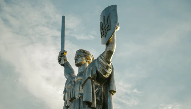 Motherland Monument in Kyiv - close-up of the statue's face and Trident shield