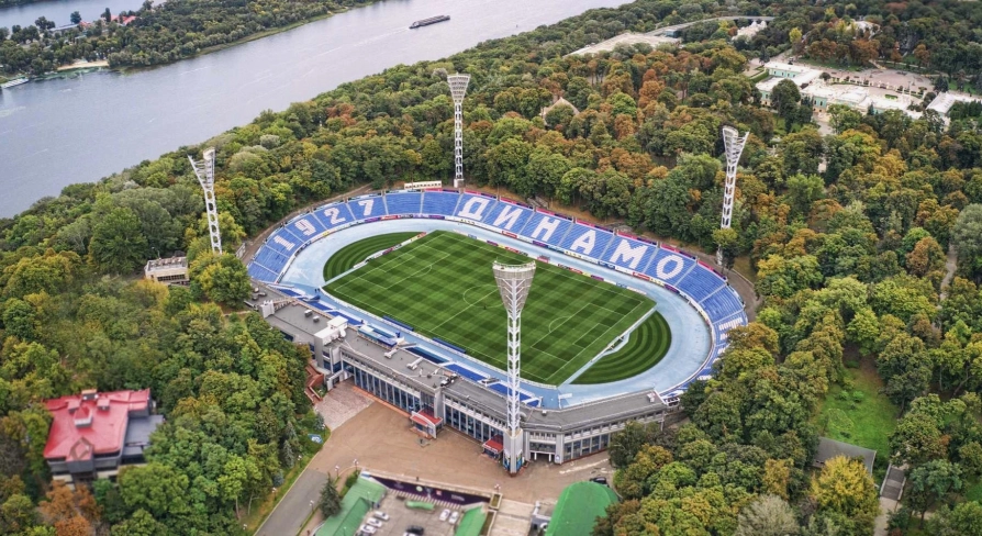 Dynamo Stadium in Kyiv - aerial view of the legendary football arena nestled among the lush green trees of the Mariinskyi Park near the Dnipro river