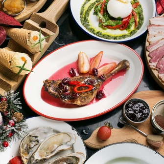 Restaurant Ostannia Barykada - overhead view of a festive table with holiday dishes and wine
