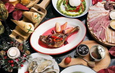 Restaurant Ostannia Barykada - overhead view of a festive table with holiday dishes and wine