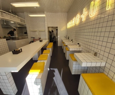 Fruit & Veg - bright interior with minimalist decor and wooden communal tables