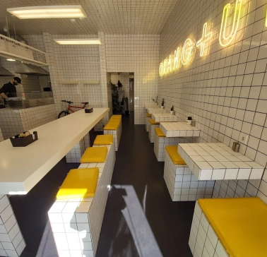 Fruit & Veg - bright interior with minimalist decor and wooden communal tables